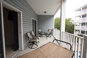 Ocean Blue Vacation Condo, Myrtle Beach - Upper Balcony with hammock, table four chairs